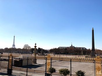 View of cityscape against blue sky