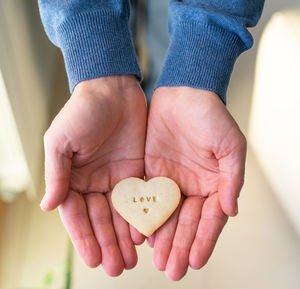 Close-up of hands holding heart shape