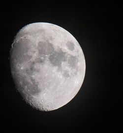 Low angle view of moon against clear sky at night