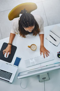 High angle view of woman working on table