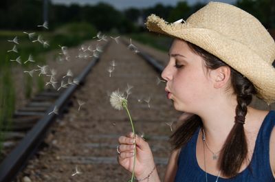 Baby girl with flowers in background