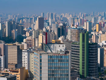 Modern buildings in city against sky