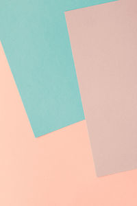 High angle view of paper on colored background