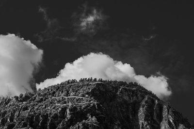 Low angle view of rock formation against sky