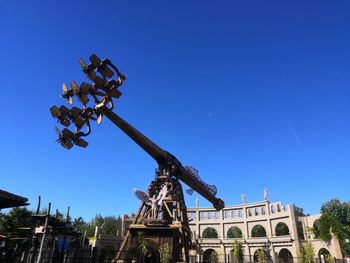 Low angle view of historical building against blue sky