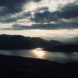 Scenic view of lake against sky during sunset