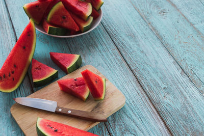 High angle view of chopped fruits on cutting board