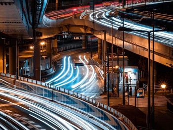 Light trails on road in city at night