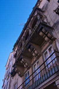 Low angle view of building against blue sky