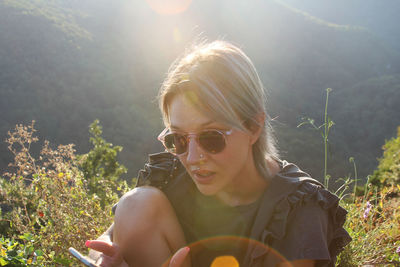 Portrait of woman wearing sunglasses during sunny day