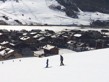 Person standing on snow covered landscape