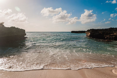 Sunset over caribbean ocean cove