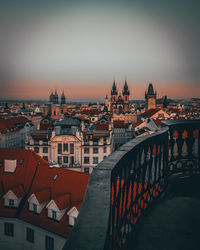 Bridge over buildings in town against sky