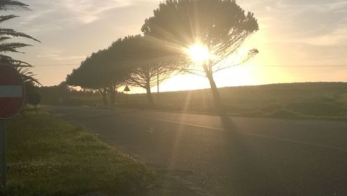 Scenic view of landscape against sky at sunset