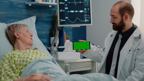 Doctor consulting patient at hospital