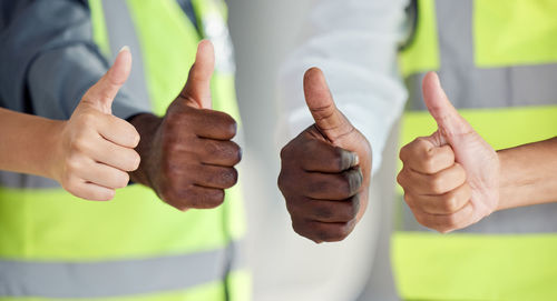 Midsection of man holding hands