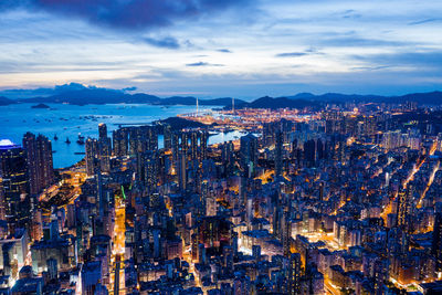 High angle view of illuminated city buildings against sky