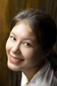 Close-up portrait of smiling woman
