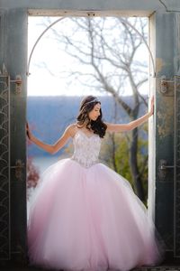Bride standing outdoors against sky