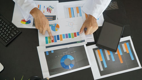 High angle view of business people working on table