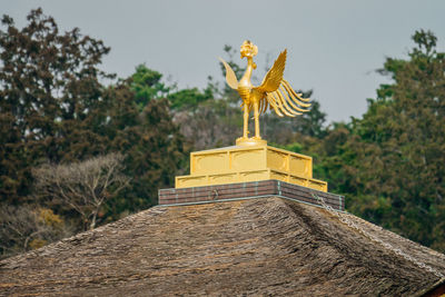 Statue of buddha against sky