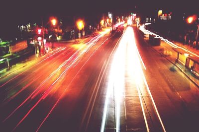 High angle view of light trails on city street at night