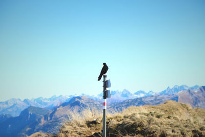Scenic view of mountains against clear blue sky