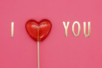 Close-up of heart shape on pink background