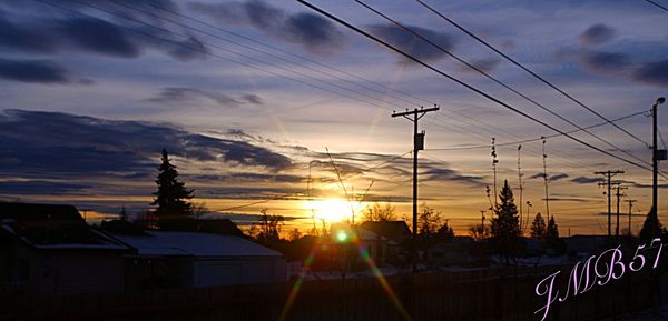 Silhouette of built structures at sunset