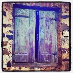 Closed door of abandoned house