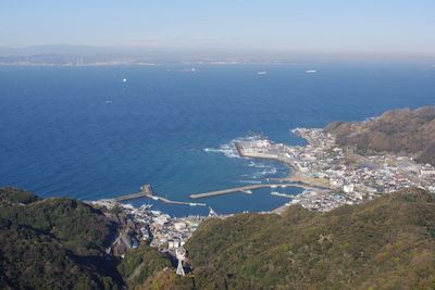 High angle view of sea and buildings against sky