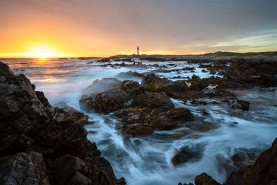 Scenic view of sea against sky during sunset