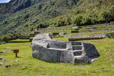 View of stone wall on field