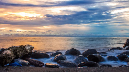 Scenic view of sea against sky during sunset