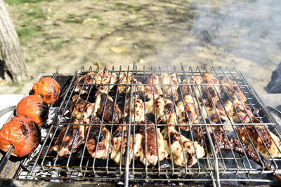 High angle view of meat on barbecue grill