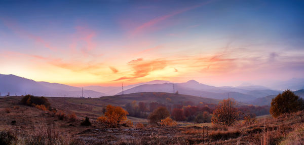 Scenic view of mountains against sky during sunset