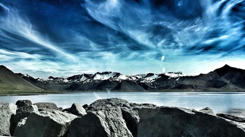 Scenic view of lake against sky during winter