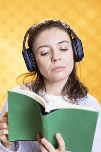 Portrait of young woman using mobile phone