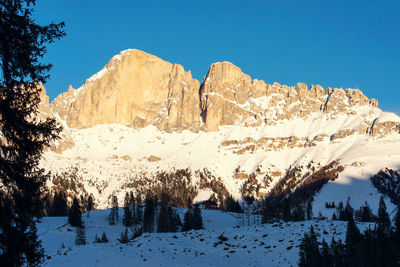 Scenic view of snowcapped mountains against clear sky