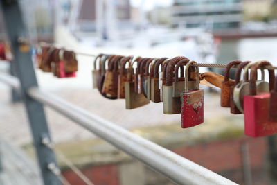 Close-up of padlocks on railing