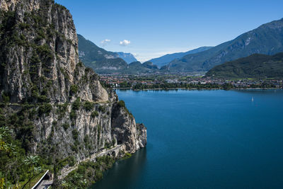 Scenic view of sea and mountains against sky