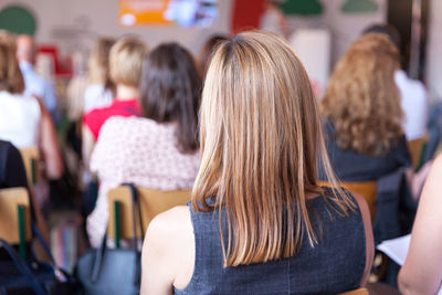 Rear view of women sitting