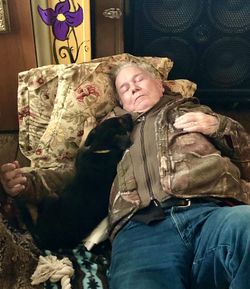 Rear view of people sleeping at home