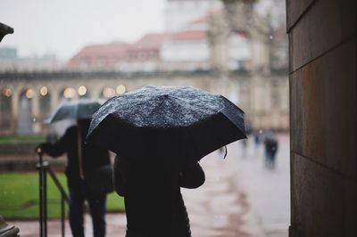 Close-up of wet umbrella during rainy season