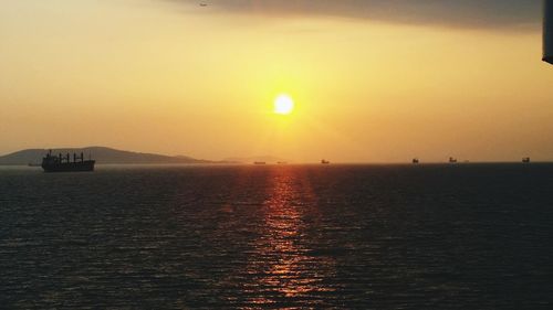 Scenic view of sea against clear sky during sunset