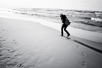 Full length of man on beach against sky