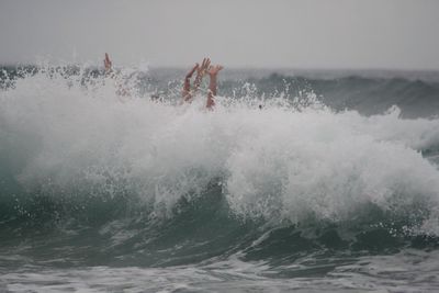 Man splashing water in sea