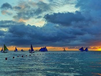 Scenic view of sea against dramatic sky