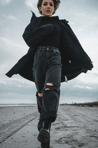 Full length of man standing on beach