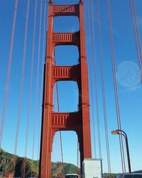 Low angle view of bridge against blue sky